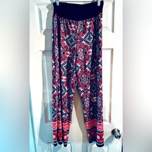 Fun wide leg stretchy pants. Bright pattern. Black waist band. Size XL